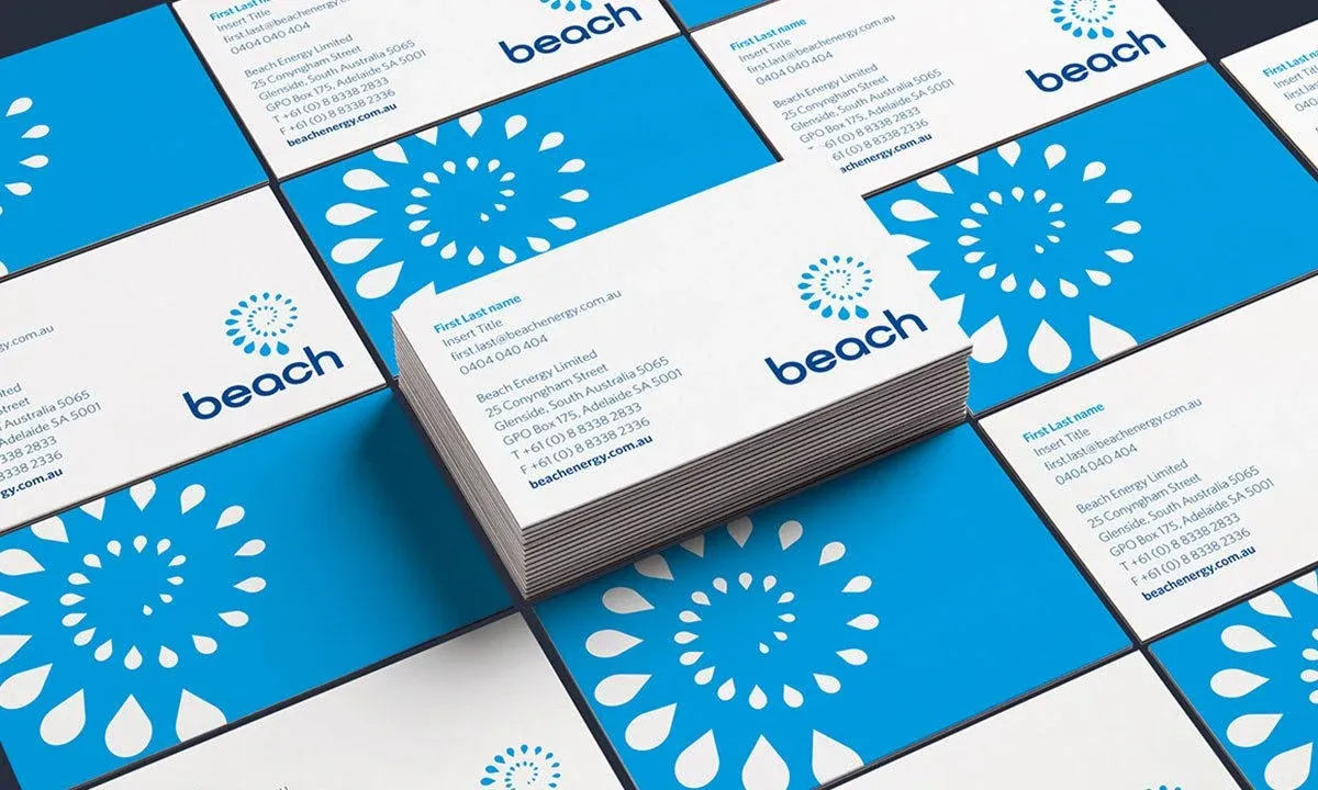 Beach Energy business cards showing the blue energy-burst identity