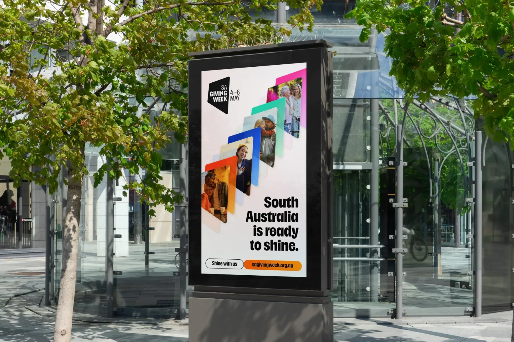 SA Giving Week street advertising with layered community portraits and the message South Australia is ready to shine