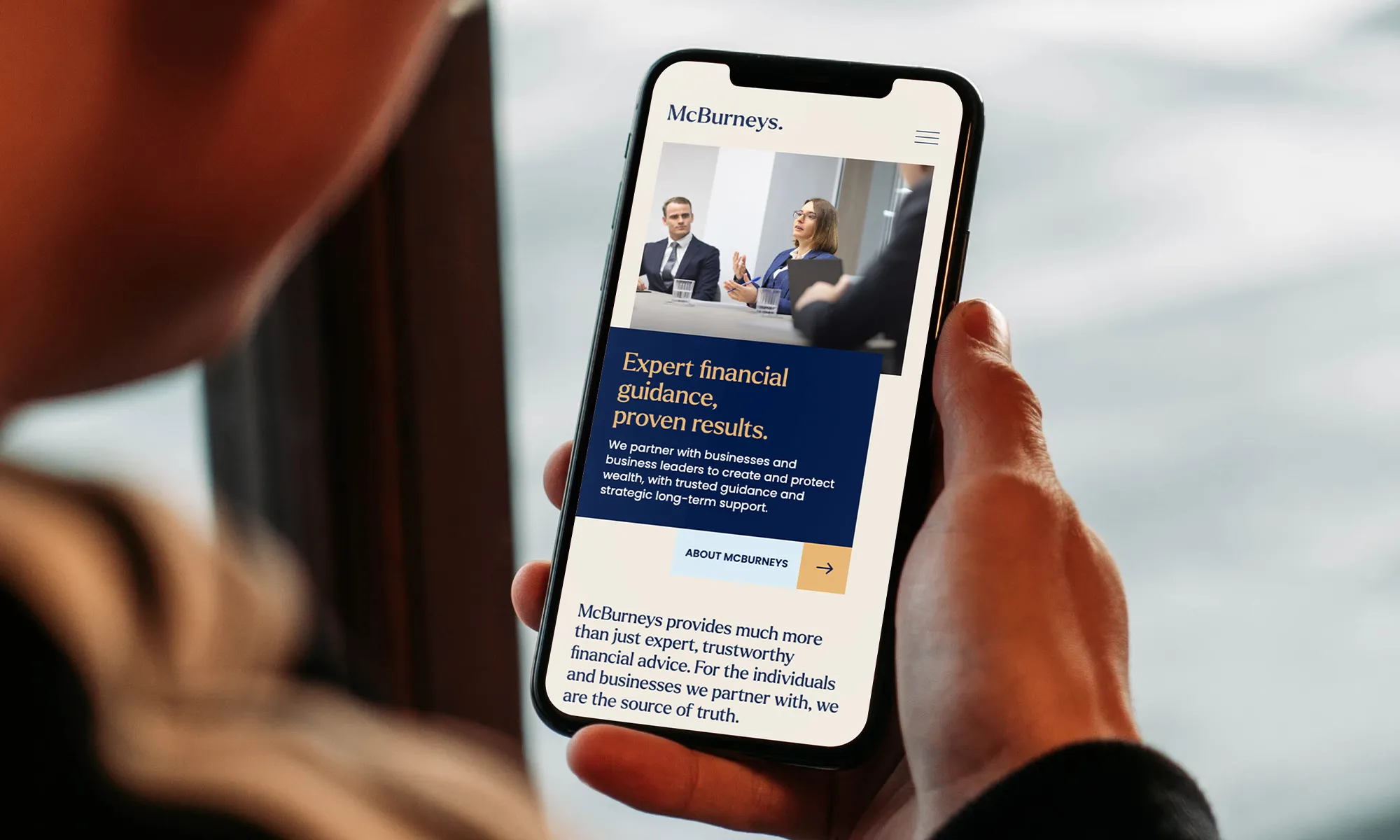 McBurneys website shown on a phone