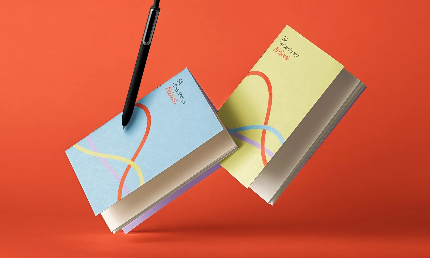 SA Philanthropy Network branded notebook with its flowing ribbon design